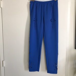 Pants with laser-cutout pattern.